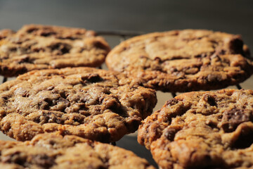 Fresh home baked chocolate chip cookies on silver baking tray