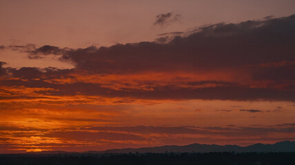 Fototapeta premium Sunset color gradient from orange to deep red