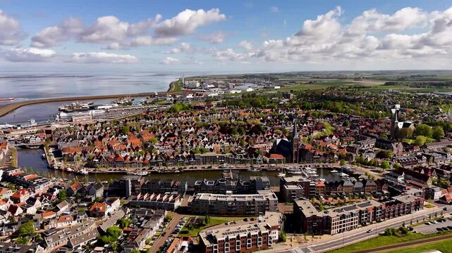 Aerial view of volendam, marken, netherlands, revealing charming harbor and colorful houses
