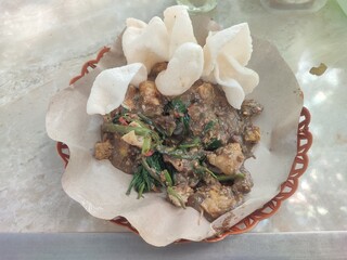 Rujak Cingur is a flavorful East Javanese delicacy from Surabaya, combining cow snout, fruits, vegetables, and spicy petis sauce into a bold, unforgettable taste.