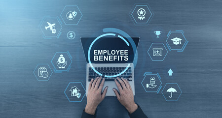 Employee benefits concept on laptop screen with icons representing workplace perks and compensation on blue background with digital interface elements.