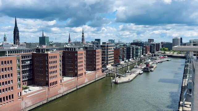 Hamburg, Germany - April 20, 2025: Hafen City Street Towards the Elbe Philharmonic Hall. Sandtorhafen. Traditionsschiffhafen in Hafencity. Old Town, Town houses. Modern residential, office building