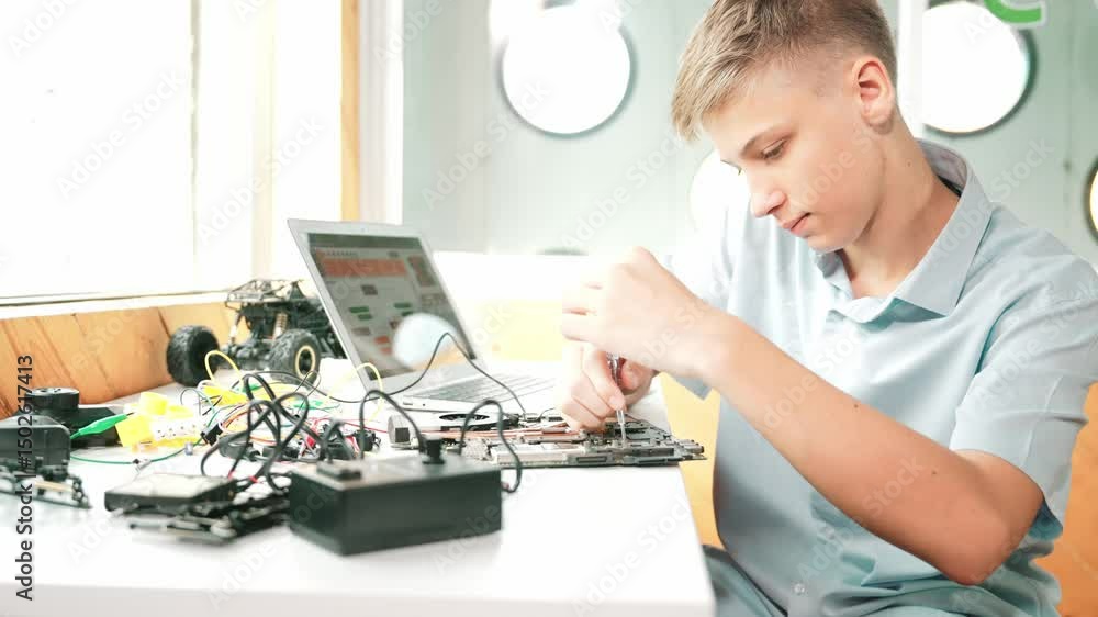 Poster caucasian boy fixing main board while study construction by using laptop analysis data. young techni