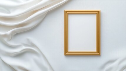 Blank gold picture frame on white satin fabric background with copy space blank picture frame empty