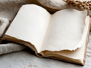 Open Handmade Notebook with Textured Paper and Soft Lighting