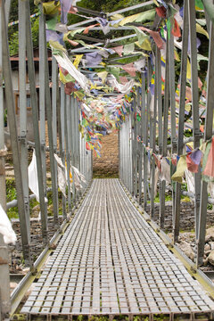 Suspension bridge adorned with prayer flags on Everest trek