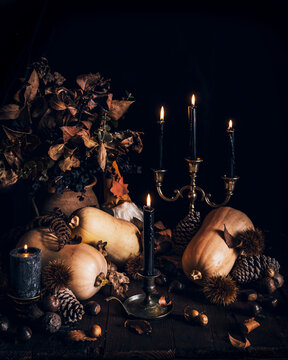 Autumn pumpkins with candles and fall elements