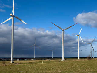 Wind turbines on Polish Baltic coast on a stormy sunny day.
