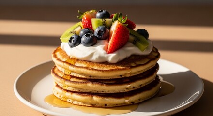 Delicious Fluffy Pancakes Topped with Fresh Berries and Whipped Cream