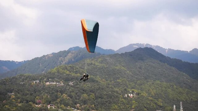 Paragliding at Bir Billing Himachal Pradesh India 2. 30 pm 10 January 2025 filmed from underneath. 4k high resolution footage.