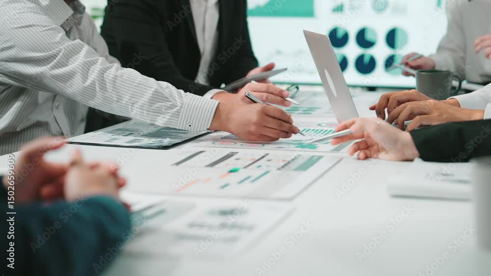 Aufkleber a group of business professionals engaged in a dynamic meeting, analyzing graphs and charts on a doc