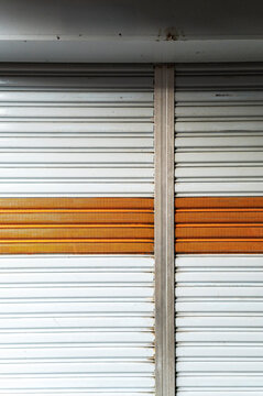 Orange stripe metal shutter pattern, Chew Jetty, Malaysia