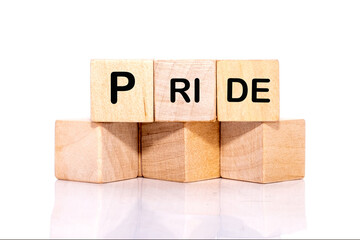 PRIDE word written on wooden blocks placed on a white background