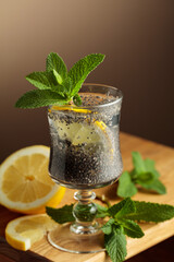 Diet vegan cocktail with chia seeds, lemon, and mint.