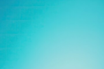 A soft gradient from a bright turquoise to a light blue
