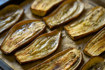 Oven roasted eggplant slices on parchment paper