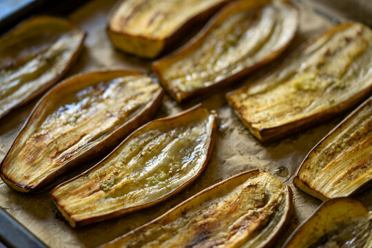 Oven roasted eggplant slices on parchment paper