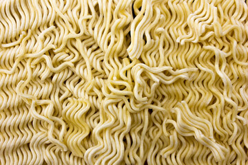 Instant noodle full square, uncooked flat lay, texture and background.