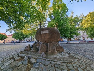 Kourim view of historical town center of with church tower, red rooftops, and narrow streets.
