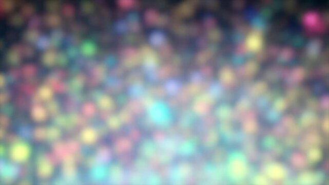Particles glowing with multi-colored light scatter and fly in different directions, an abstract beautiful shining background that gradually fades into blur