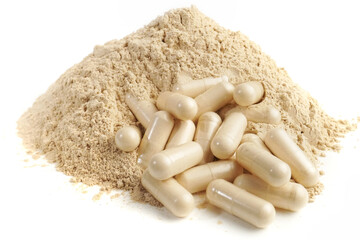 Ashwagandha powder and capsules as supplement isolated on white background