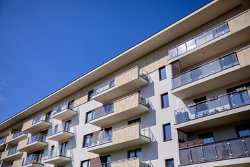 Fototapeta premium A modern apartment building stands proudly under a clear and inviting blue sky today