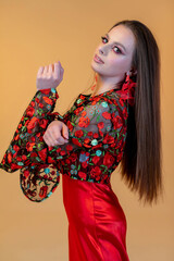 This is an Elegant Fashion Portrait featuring Vibrant Colors and Intricate Floral Patterns