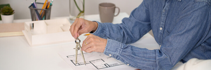 Architect Hand Design Blueprint with Compass on Desk Architecture Project Planning with Compass for...