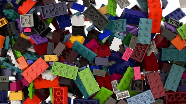 Colorful plastic bricks are falling, bouncing, and accumulating on a white background, creating a playful and dynamic scene ideal for educational or creative content