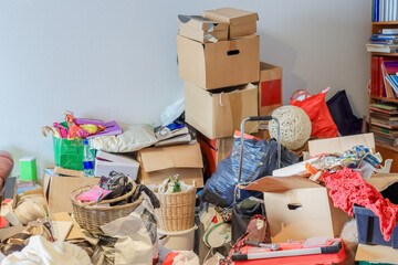 Hoarder's living room is filled with possessions. Hoarding disorder is a mental health problem. The homeowner doesn't want to let go of anything, not even trash. All logos and texts have been removed.