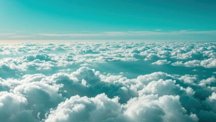 Aerial view of clouds with dreamy turquoise sky