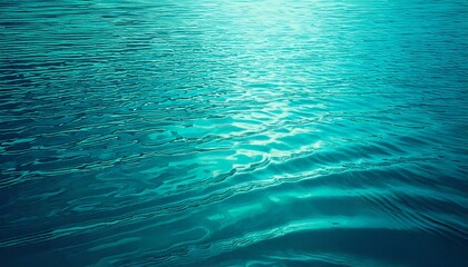 Water, reflection, ripples, light, surface — a serene blue-green water background features gentle wave patterns with delicate ripples, as light dances across the surface, creating a peaceful, fluid, a