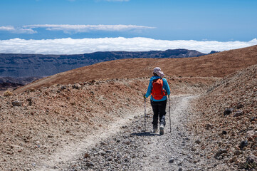 tourist on the mountain trail on the Teide volcano in Tenerife.