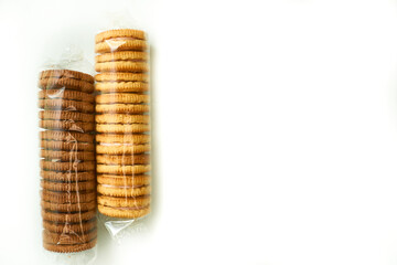 Two sweet cookies packs in protective cellophane,package for sale on white 