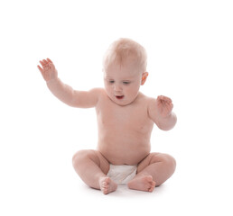 Cute little baby sitting on white background
