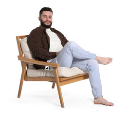 Handsome man relaxing on chair against white background