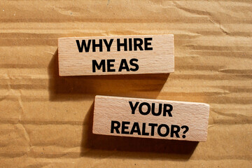 Why hire me as your realtor message written on wooden blocks on cardboard background. Conceptual...