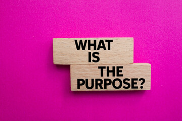 What is the purpose message written on wooden blocks on pink background. Conceptual what is the...
