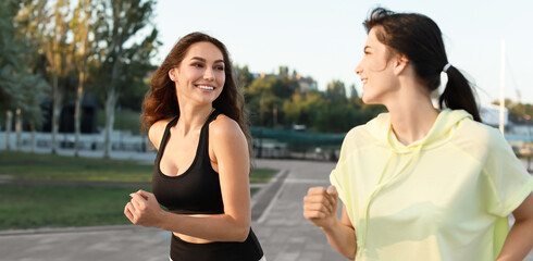 Beautiful young women running outdoors