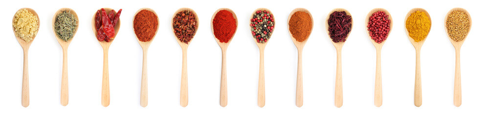 Different aromatic spices in wooden spoons on white background, set. Top view