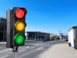 Traffic lights on city street. Signaling device