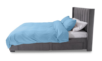 Bed made up with beautiful linens on white background