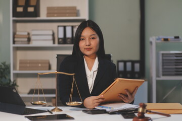 Judge gavel with Justice lawyers having team meeting at law firm background. Concepts of Law and...