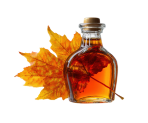 Maple syrup in a glass bottle with autumn leaves decoration on a transparent background, cut out