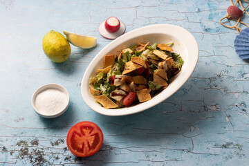 Traditional Lebanese fattoush salad with toasted bread and lemon dressing.

