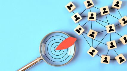 Magnifying Glass Targeting Audience with Connected People Icons