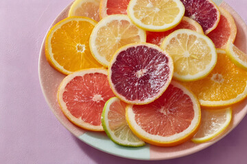 Top View of Sliced Citrus Fruits on Pastel Plate