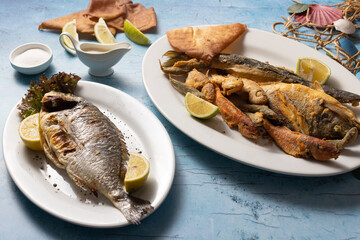 Lebanese seafood platter with sides, served on styled mezze table.