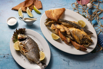 Lebanese seafood platter with sides, served on styled mezze table.