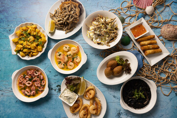 Assorted Lebanese seafood and hot mezza served on festive table.
